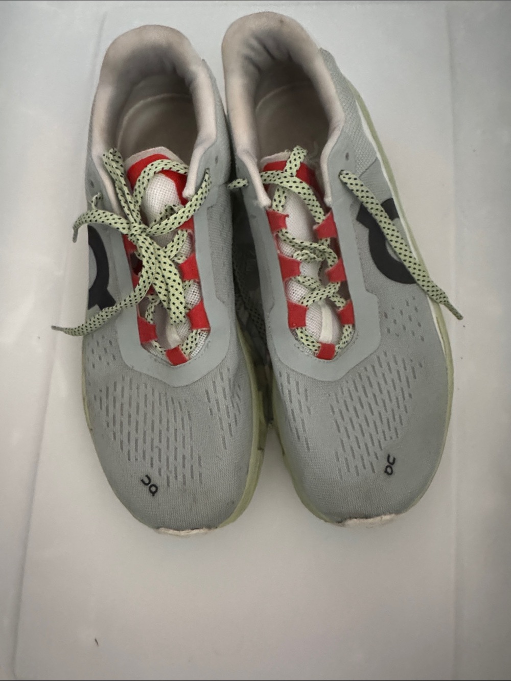 On Running Women's Gray Athletic Sneakers with Red Accents and Pale Green Laces